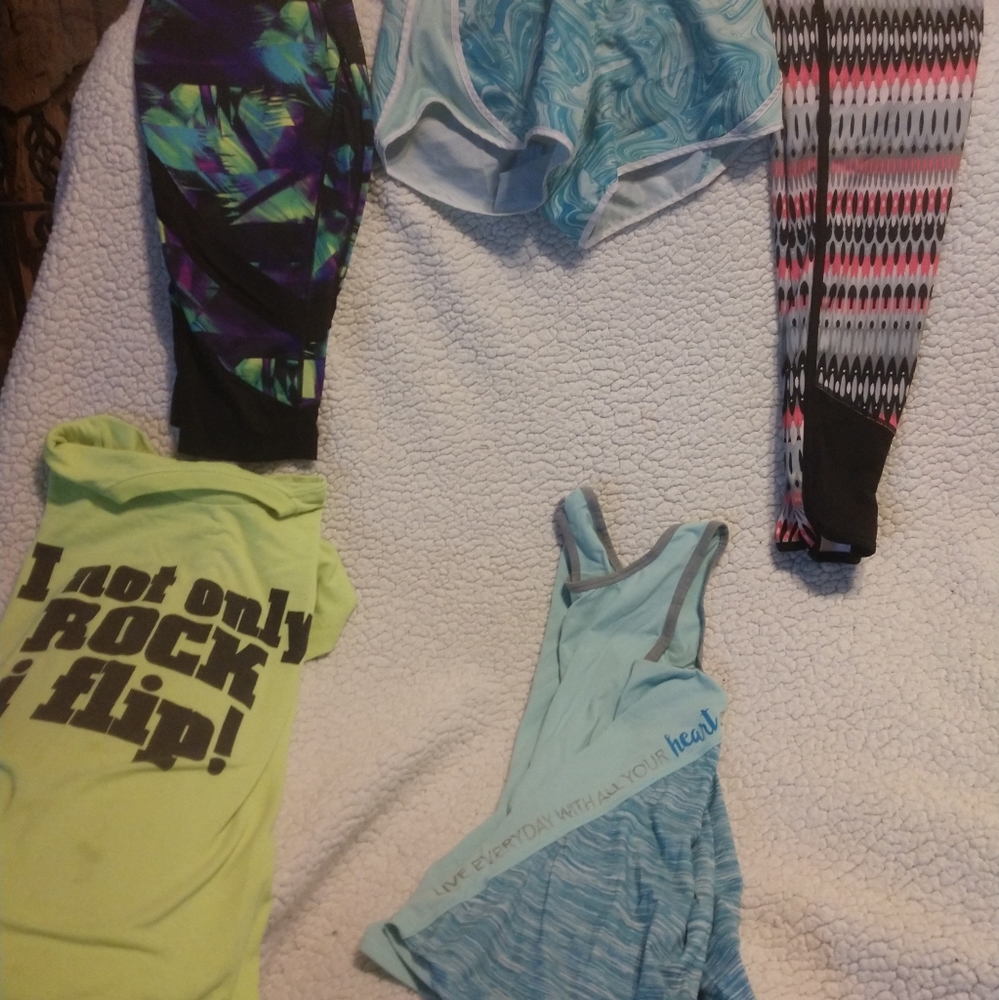 Two athletic outfits and a pair of leggings